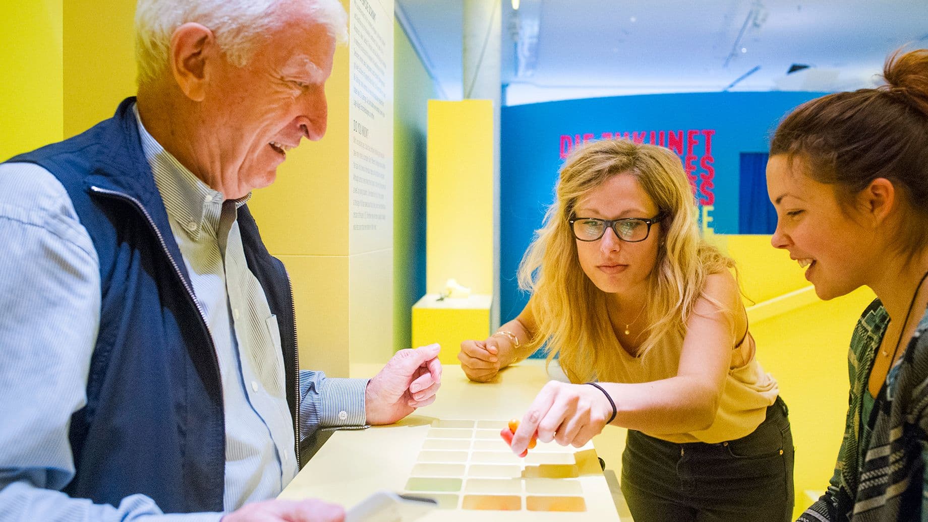 Three people play the pill game